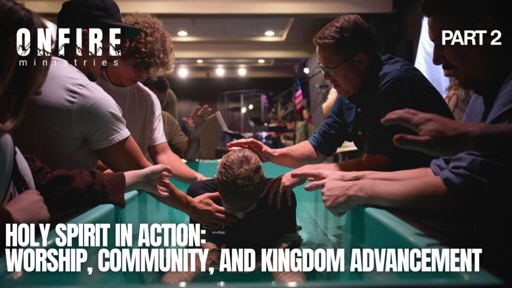 A person being baptized in a teal baptismal pool as multiple hands reach in to support them, surrounded by a church community. Bold white text reads: 'Holy Spirit in Action: Worship, Community, and Kingdom Advancement — Part 2.' On Fire Ministries logo in the upper left.
